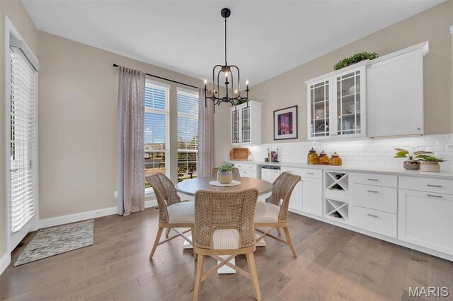 501 Upper Ridgepointe Ct, Lake St Louis, MO 63367 - dining room featuring wood finished floors and a chandelier