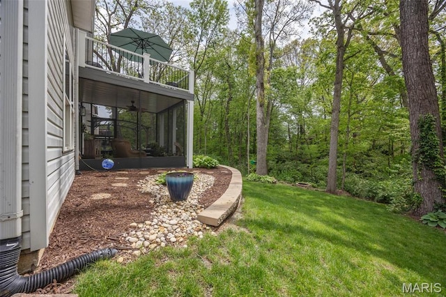 611 Woodchuck Ln, Lake St Louis, MO 63367 - view of grassy yard with a balcony and a sunroom