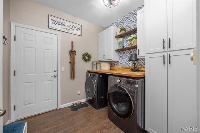 611 Woodchuck Ln, Lake St Louis, MO 63367 - clothes washing area featuring cabinet space, washing machine and dryer, dark wood-type flooring, and baseboards