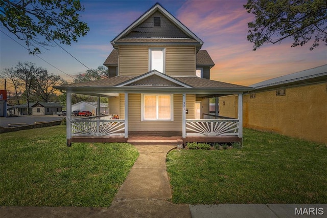 323 N Division St, Bonne Terre, MO 63628 - view of front of house with a porch, a yard, and a shingled roof