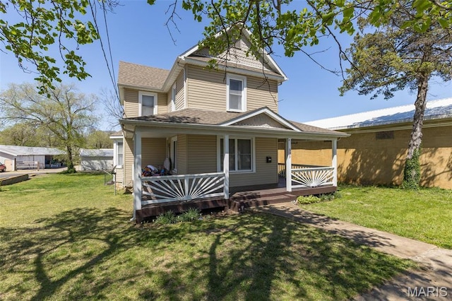 323 N Division St, Bonne Terre, MO 63628 - view of front of property featuring a front yard, a porch, and a shingled roof