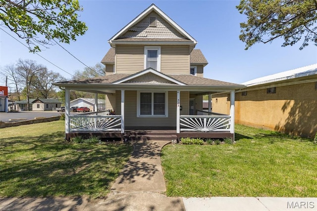 323 N Division St, Bonne Terre, MO 63628 - view of front of home with a shingled roof, a front lawn, and a porch
