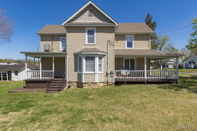 323 N Division St, Bonne Terre, MO 63628 - victorian house featuring a porch, a front yard, and roof with shingles