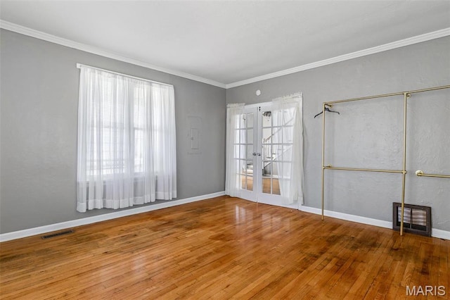 323 N Division St, Bonne Terre, MO 63628 - empty room featuring wood finished floors, french doors, ornamental molding, and baseboards
