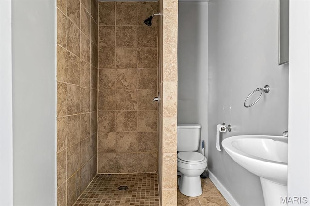 323 N Division St, Bonne Terre, MO 63628 - bathroom featuring a shower stall, toilet, baseboards, and tile patterned flooring