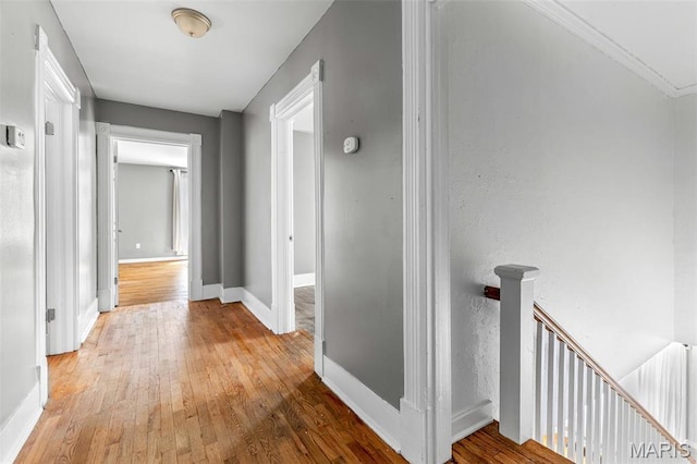 323 N Division St, Bonne Terre, MO 63628 - corridor with an upstairs landing, light wood-style floors, and baseboards