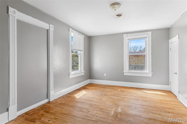 323 N Division St, Bonne Terre, MO 63628 - unfurnished bedroom featuring multiple windows, wood finished floors, and baseboards