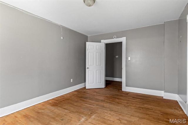 323 N Division St, Bonne Terre, MO 63628 - spare room with baseboards and wood finished floors
