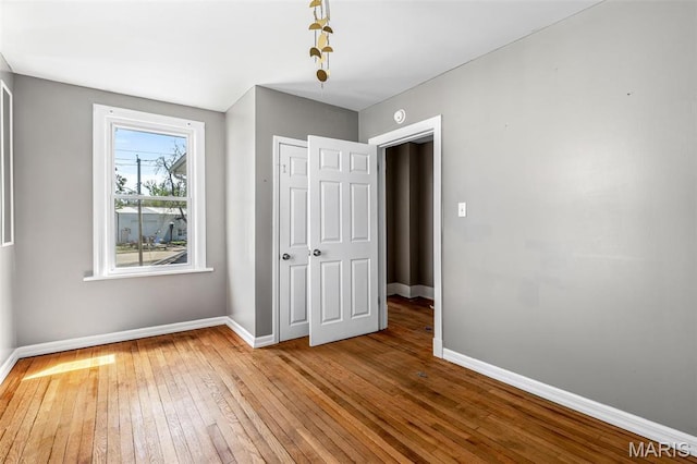 323 N Division St, Bonne Terre, MO 63628 - unfurnished bedroom with wood-type flooring, baseboards, and a closet