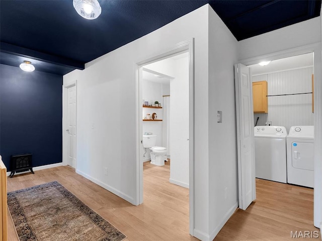 403 Virginia Ave, Potosi, MO 63664 - hall featuring washer and dryer, light wood-style flooring, and baseboards
