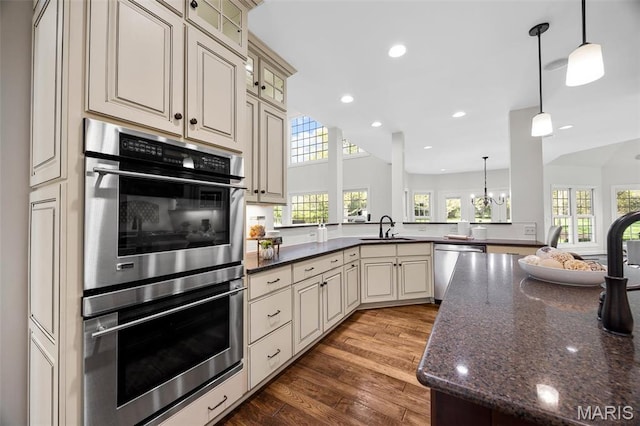 1264 Wilton Ln, Saint Louis, MO 63122 - kitchen featuring appliances with stainless steel finishes, a sink, wood finished floors, recessed lighting, and cream cabinets