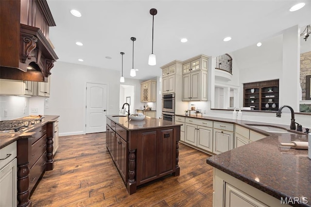 1264 Wilton Ln, Saint Louis, MO 63122 - kitchen featuring cream cabinets, a sink, stainless steel appliances, dark wood-style floors, and recessed lighting