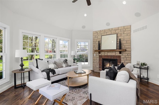 1264 Wilton Ln, Saint Louis, MO 63122 - living area featuring dark wood-style flooring, baseboards, a fireplace, a ceiling fan, and high vaulted ceiling
