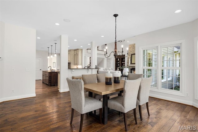 1264 Wilton Ln, Saint Louis, MO 63122 - dining area with dark wood-style flooring, a chandelier, baseboards, and recessed lighting
