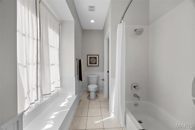 1264 Wilton Ln, Saint Louis, MO 63122 - bathroom with toilet, tile patterned floors, wainscoting, and shower / bath combination with curtain