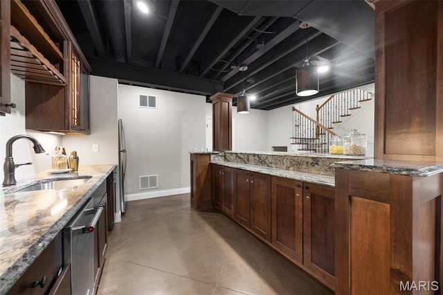 1264 Wilton Ln, Saint Louis, MO 63122 - kitchen with a sink, dishwasher, baseboards, finished concrete flooring, and light stone counters