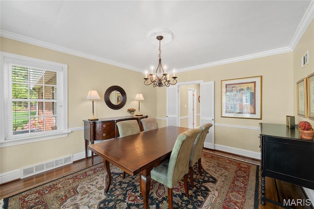 133 Webster Woods Dr, Saint Louis, MO 63119 - dining room featuring a chandelier, crown molding, wood finished floors, and baseboards