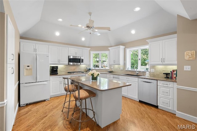 133 Webster Woods Dr, Saint Louis, MO 63119 - kitchen featuring stainless steel appliances, a sink, light wood finished floors, white cabinetry, and recessed lighting