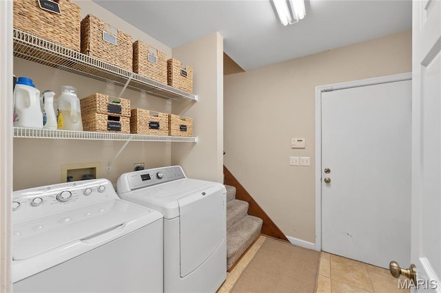 133 Webster Woods Dr, Saint Louis, MO 63119 - laundry area with separate washer and dryer, light tile patterned floors, and baseboards