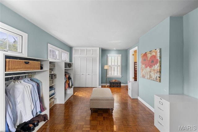 133 Webster Woods Dr, Saint Louis, MO 63119 - bedroom featuring multiple windows, a closet, and baseboards