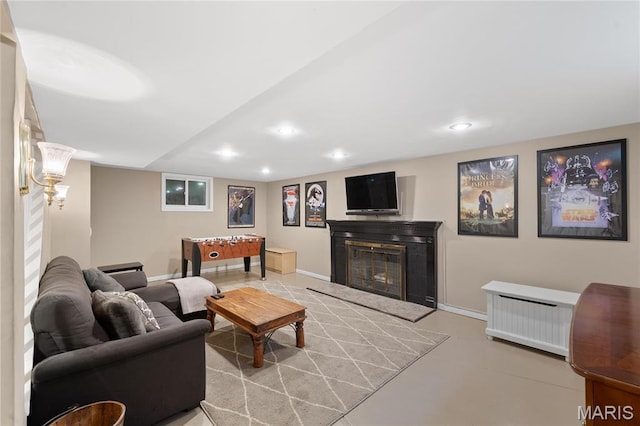 133 Webster Woods Dr, Saint Louis, MO 63119 - living area with baseboards, recessed lighting, finished concrete floors, and a glass covered fireplace
