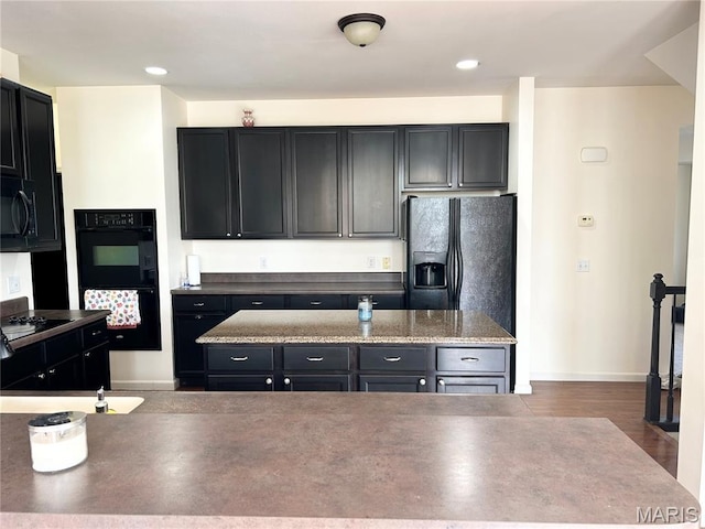 833 Harding St, Saint Peters, MO 63376 - kitchen with black appliances, dark cabinets, baseboards, and recessed lighting