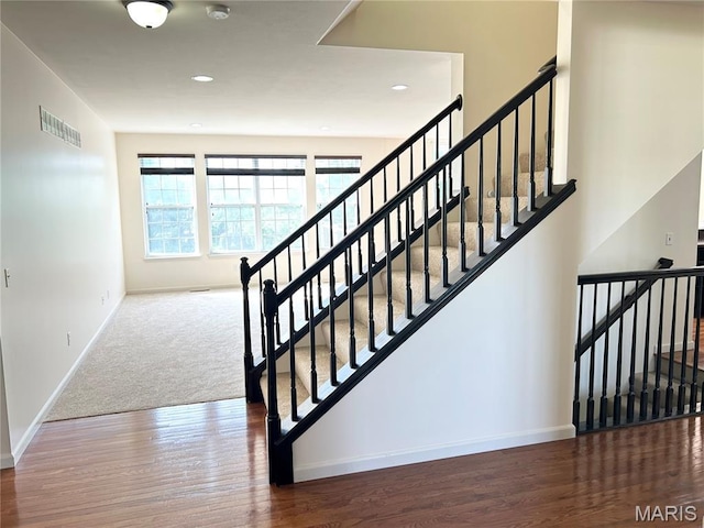 833 Harding St, Saint Peters, MO 63376 - stairway with baseboards, wood finished floors, and recessed lighting