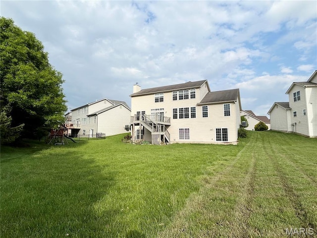 833 Harding St, Saint Peters, MO 63376 - rear view of property featuring a yard, a chimney, stairs, and a wooden deck
