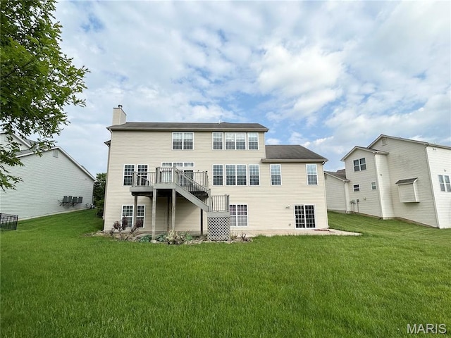 833 Harding St, Saint Peters, MO 63376 - back of property featuring a chimney, a lawn, and a deck