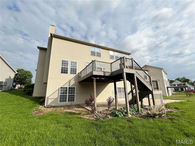 833 Harding St, Saint Peters, MO 63376 - back of property featuring a wooden deck, a yard, a chimney, and stairs