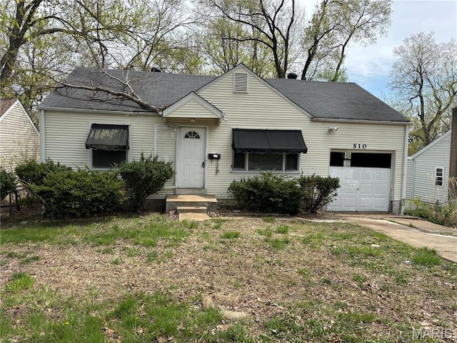 510 Ames Pl, Ferguson, MO 63135 - view of front of property featuring an attached garage, driveway, and roof with shingles