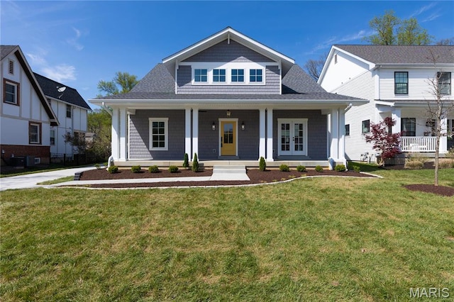 705 W Lockwood Ave, Glendale, MO 63122 - view of front facade with a porch, a front yard, and french doors