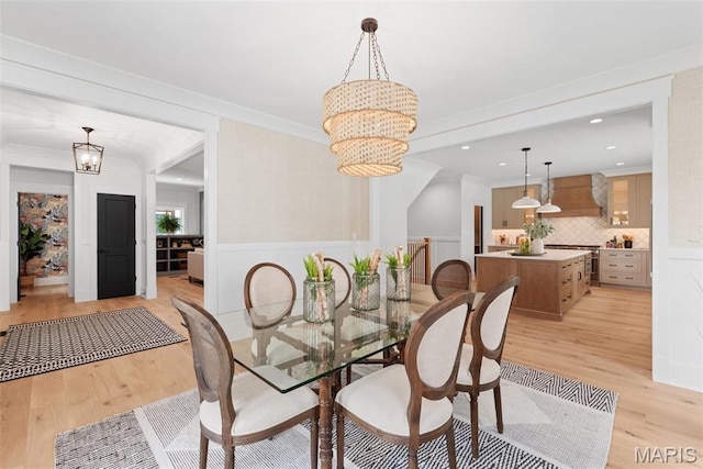 705 W Lockwood Ave, Glendale, MO 63122 - dining space with a chandelier, light wood-style floors, crown molding, a wainscoted wall, and recessed lighting