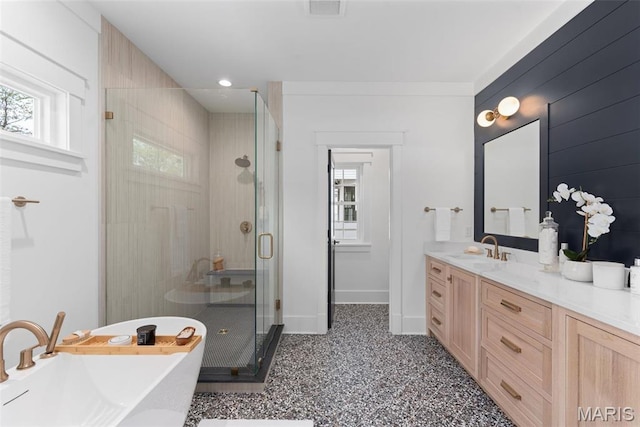 705 W Lockwood Ave, Glendale, MO 63122 - full bath with a freestanding bath, a stall shower, vanity, and baseboards