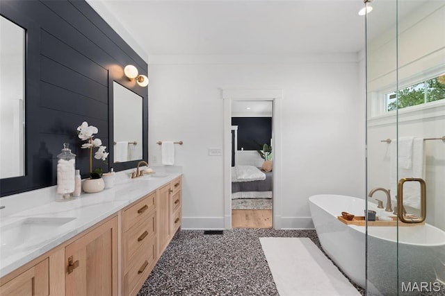 705 W Lockwood Ave, Glendale, MO 63122 - full bathroom with ensuite bathroom, a freestanding bath, baseboards, double vanity, and a shower with door
