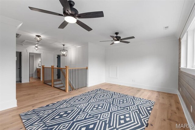 705 W Lockwood Ave, Glendale, MO 63122 - unfurnished room featuring ceiling fan, light wood-style floors, baseboards, and attic access