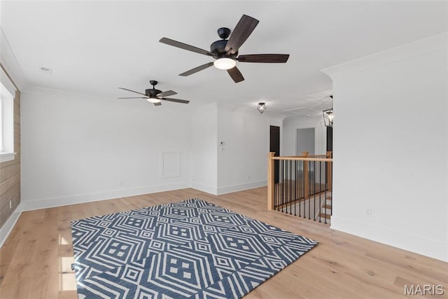 705 W Lockwood Ave, Glendale, MO 63122 - spare room with attic access, wood finished floors, ceiling fan, baseboards, and crown molding