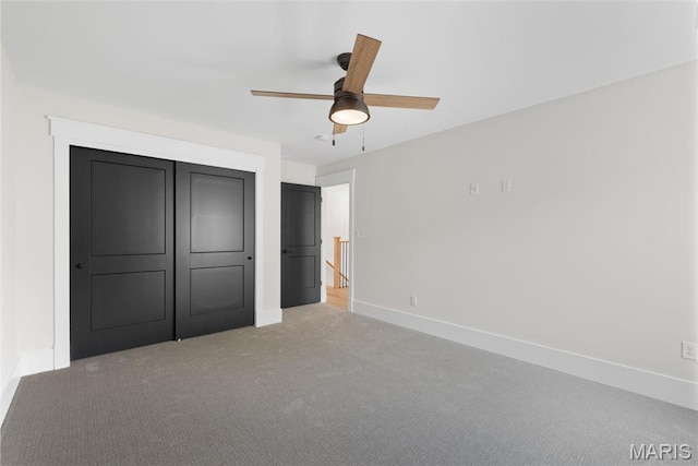 705 W Lockwood Ave, Glendale, MO 63122 - unfurnished bedroom featuring carpet flooring, baseboards, a ceiling fan, and a closet