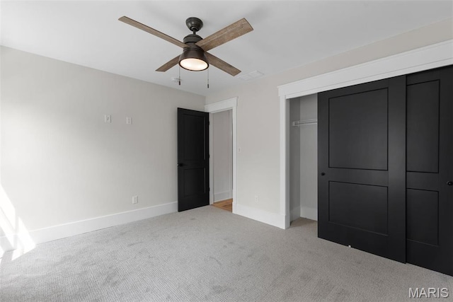 705 W Lockwood Ave, Glendale, MO 63122 - unfurnished bedroom with carpet floors, baseboards, a closet, and a ceiling fan