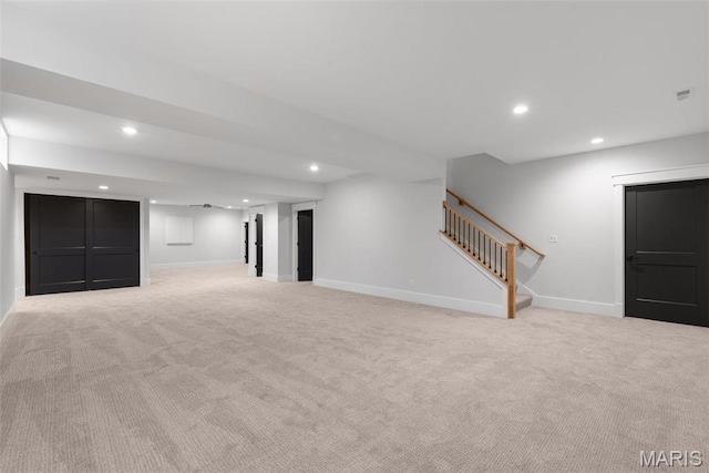 705 W Lockwood Ave, Glendale, MO 63122 - finished below grade area featuring recessed lighting, stairs, light colored carpet, and baseboards