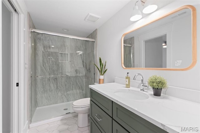 705 W Lockwood Ave, Glendale, MO 63122 - full bath featuring a marble finish shower, tile patterned flooring, toilet, and vanity