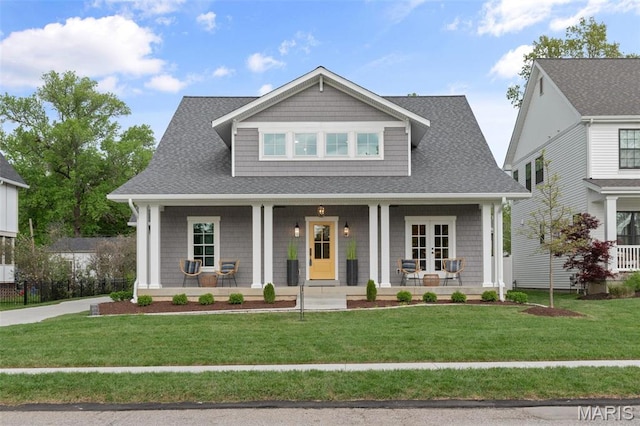 705 W Lockwood Ave, Glendale, MO 63122 - craftsman inspired home featuring covered porch, a front yard, and a shingled roof