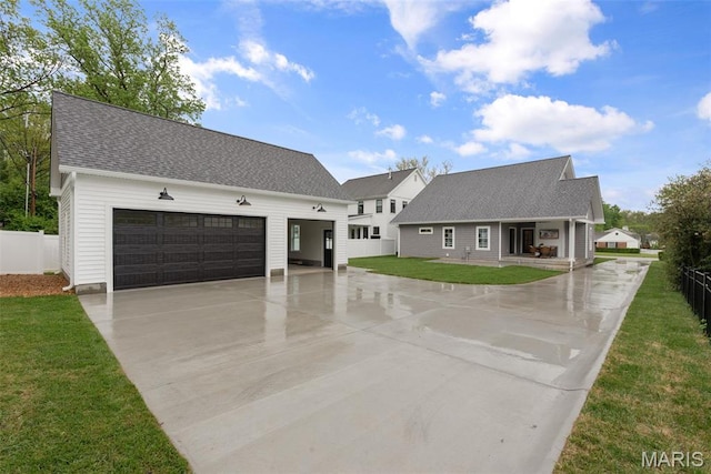 705 W Lockwood Ave, Glendale, MO 63122 - modern farmhouse featuring concrete driveway, a shingled roof, a garage, and covered porch
