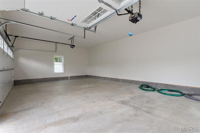 705 W Lockwood Ave, Glendale, MO 63122 - garage with a garage door opener and baseboards