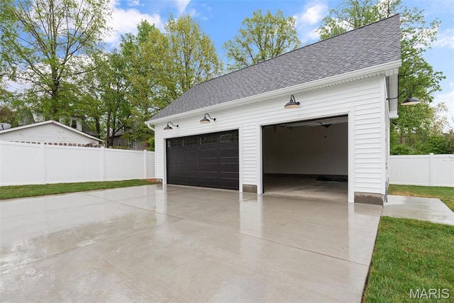 705 W Lockwood Ave, Glendale, MO 63122 - garage featuring concrete driveway and fence
