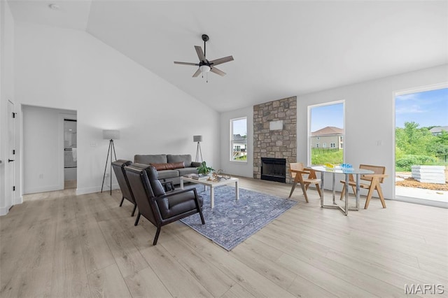 6345 Gibison Rd, Troy, MO 63379 - living room with a ceiling fan, a fireplace, light wood-type flooring, and high vaulted ceiling