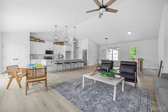 6345 Gibison Rd, Troy, MO 63379 - living area with a ceiling fan, light wood-style flooring, recessed lighting, and high vaulted ceiling