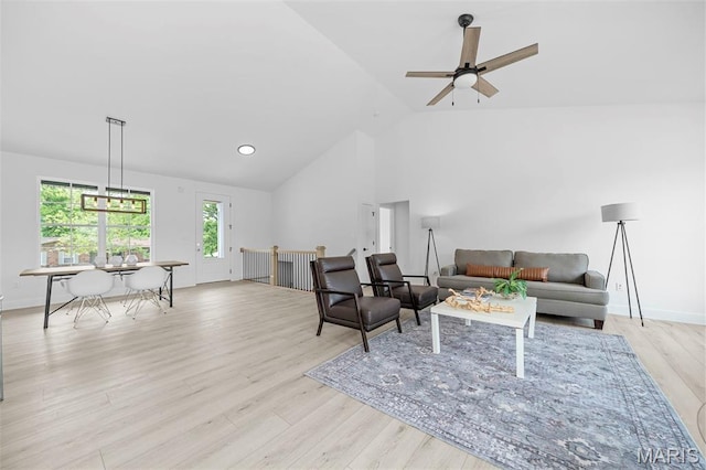 6345 Gibison Rd, Troy, MO 63379 - living area with a ceiling fan, wood finished floors, high vaulted ceiling, and baseboards