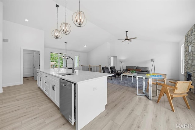 6345 Gibison Rd, Troy, MO 63379 - kitchen featuring a sink, stainless steel dishwasher, lofted ceiling, a ceiling fan, and white cabinets