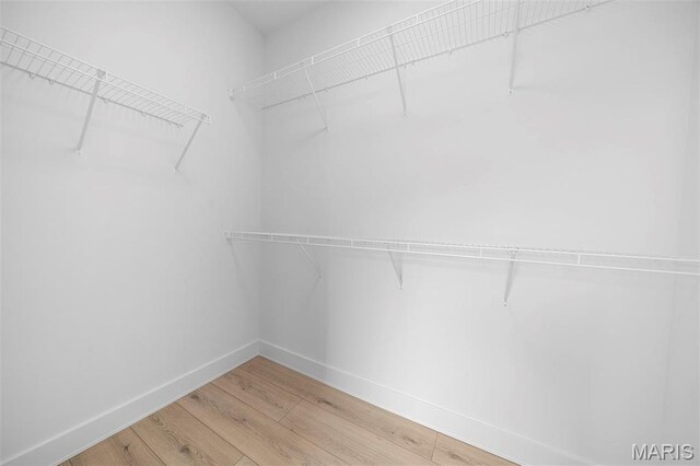 6345 Gibison Rd, Troy, MO 63379 - walk in closet featuring light wood-type flooring
